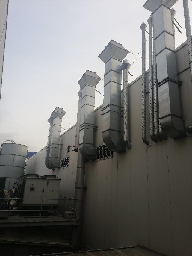 Industrial ventilation ducts on a facade